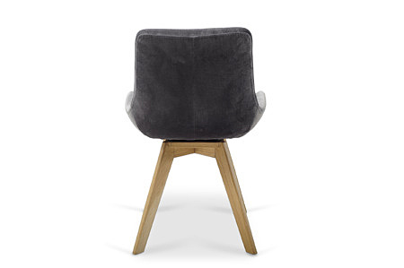 Bequemer schwarzer Stuhl auf hellen Holzbeinen. Hersteller Dobrodzień Polen
